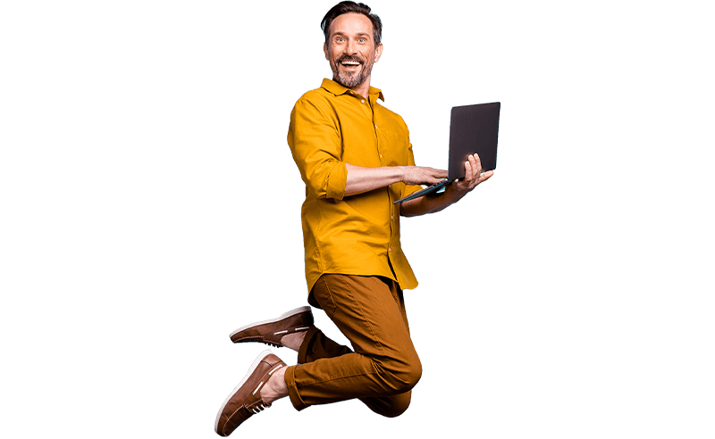 casual professional man in yellow shirt with laptop jumping for joy